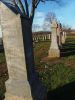 Jamestown-Cemetary_view_looking_along_a_row_of_headstones.JPG